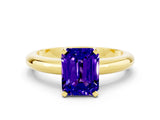 Yellow gold Emerald Cut Tanzanite Solitaire Engagement Ring with Round Band and Four-Prong Setting