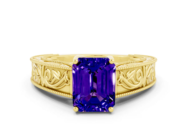 Yellow gold Emerald Cut Tanzanite Solitaire Ring with Engraved Band and Four-Prong Setting