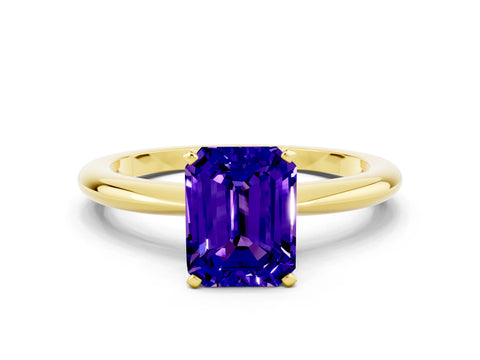 Yellow gold Emerald Cut Tanzanite Solitaire Ring with Six-Prong Setting and Classic Band