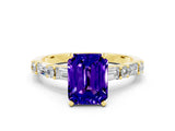 Yellow gold Emerald Cut Tanzanite Solitaire with Side Baguettes and Channel Set Band