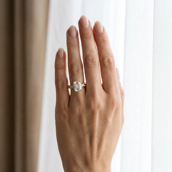 Yellow gold Emerald Cut Twisted Pavé Band Solitaire Ring with Four-Prong Setting