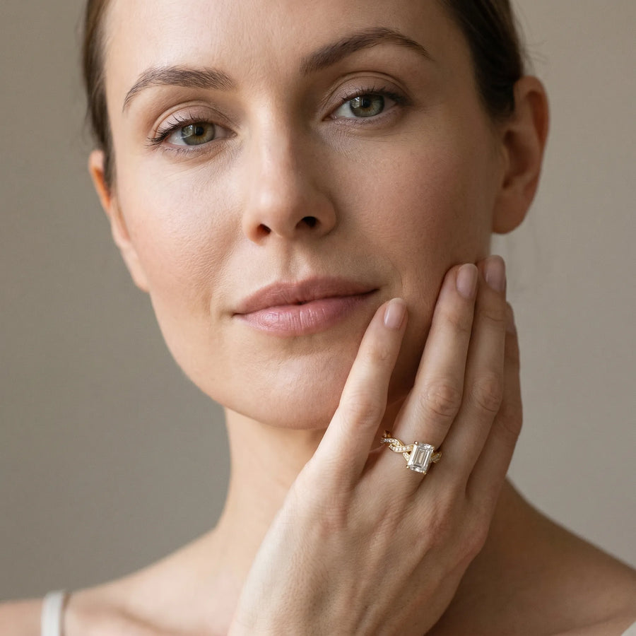 Yellow gold Emerald Cut Twisted Pavé Band Solitaire Ring with Four-Prong Setting