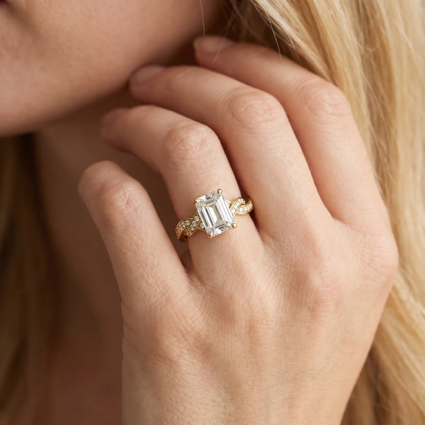 Yellow gold Emerald Cut Twisted Pavé Band Solitaire Ring with Four-Prong Setting