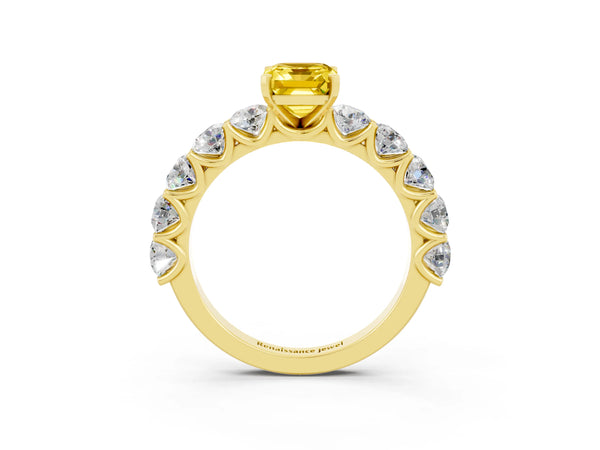 Yellow gold Emerald Cut Yellow Sapphire Prong Setting with Side Stones on a Pave Band