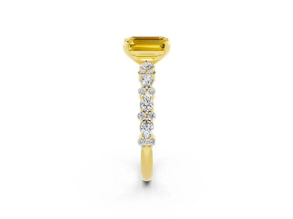 Yellow gold Emerald Cut Yellow Sapphire Side Stone Solitaire Ring with Round  and Four-Prong Setting