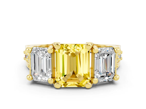 Yellow gold Emerald Cut Yellow Sapphire Three-Stone Ring with Channel Set Band and Four-Prong Setting
