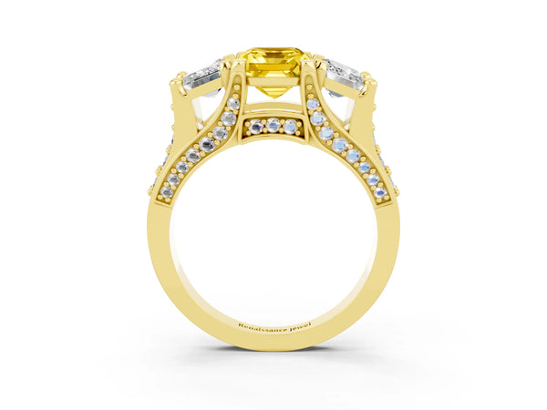 Yellow gold Emerald Cut Yellow Sapphire Three-Stone Ring with Channel Set Band and Four-Prong Setting