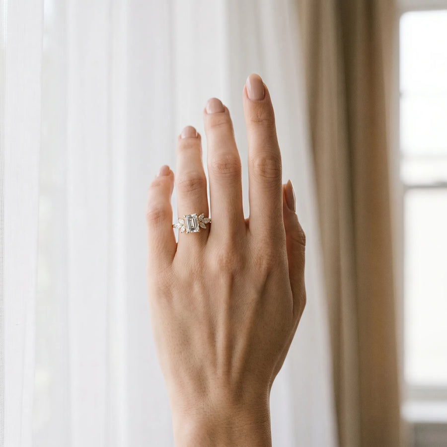 Yellow gold Emerald Diamond Floral Cluster Ring with Marquise Side Stones and Six-Prong Solitaire Setting