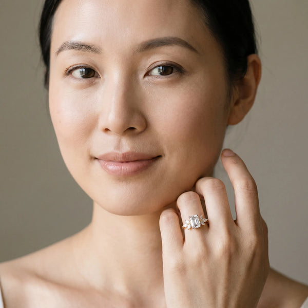 Yellow gold Emerald Diamond Floral Cluster Ring with Marquise Side Stones and Six-Prong Solitaire Setting