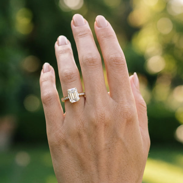Yellow gold Emerald Diamond Solitaire with Pave Band and Six-Prong Setting