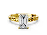 Yellow gold Emerald Solitaire Diamond Engagement Ring with XO Engraved Band and Four-Prong Setting