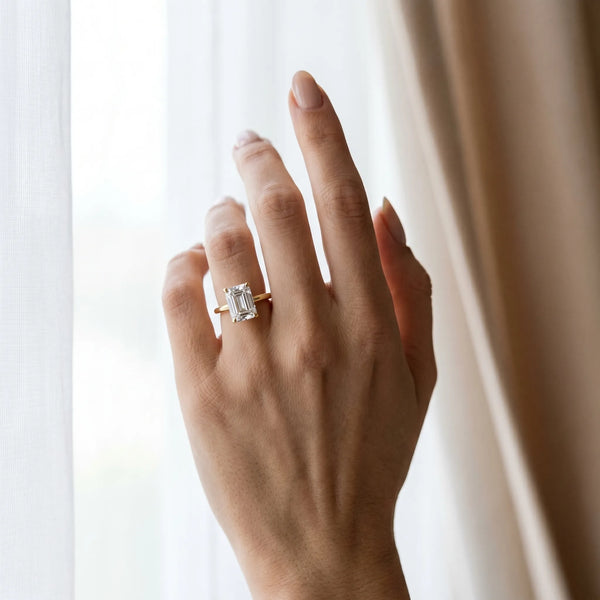 Yellow gold Emerald Solitaire Diamond Ring with 4-Prong Setting on a Classic Band