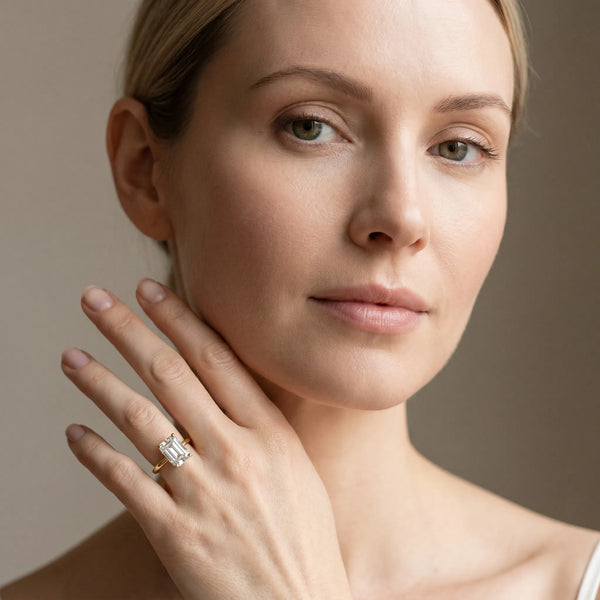 Yellow gold Emerald Solitaire Diamond Ring with 4-Prong Setting on a Classic Band