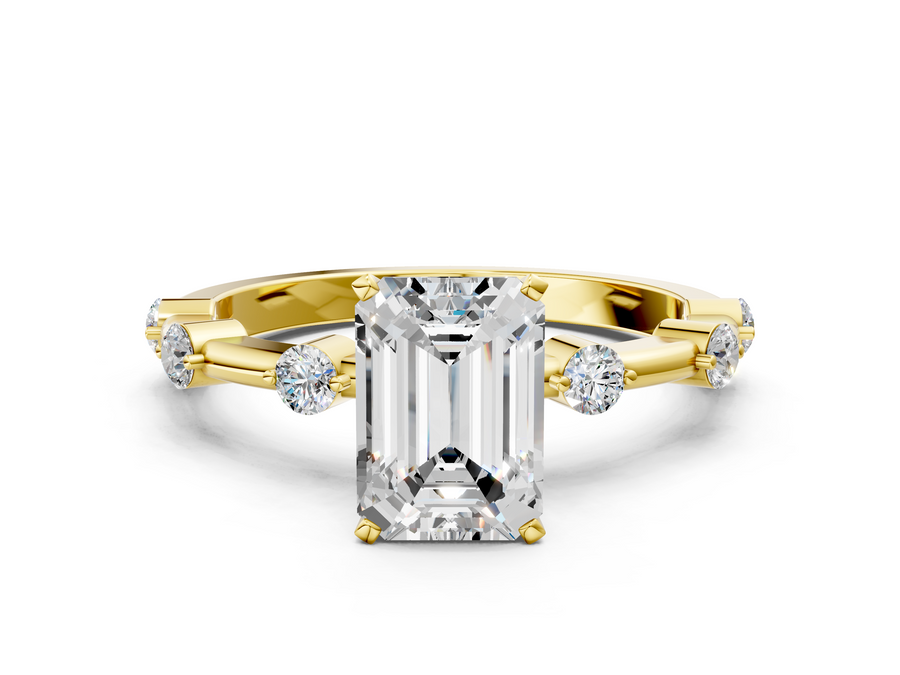 Yellow gold Emerald Solitaire Diamond Ring with Bezel Set Side Stones and Prong Setting