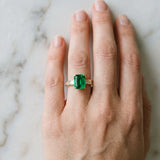Yellow gold Emerald Solitaire Diamond Ring with Channel-Set Baguette Band and Four-Prong Setting_141