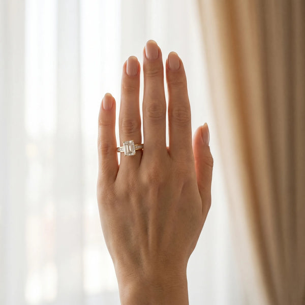 Yellow gold Emerald Solitaire Diamond Ring with Channel-Set Band and Four-Prong Setting