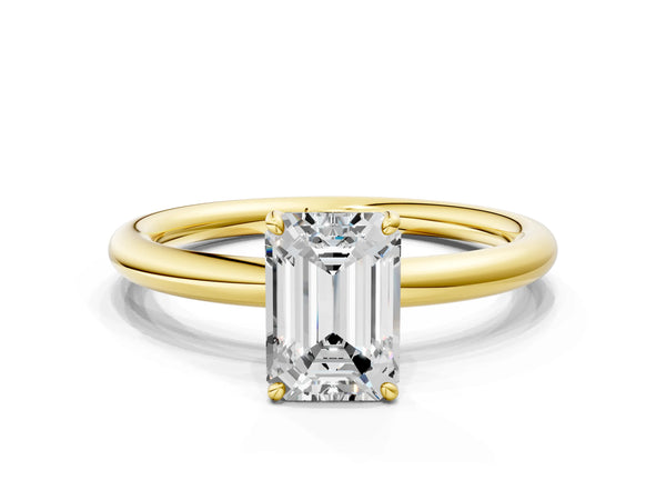 Yellow gold Emerald Solitaire Diamond Ring with Four-Prong Setting on a Plain Band