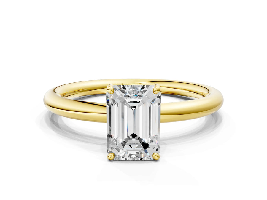 Yellow gold Emerald Solitaire Diamond Ring with Four-Prong Setting on a Plain Band