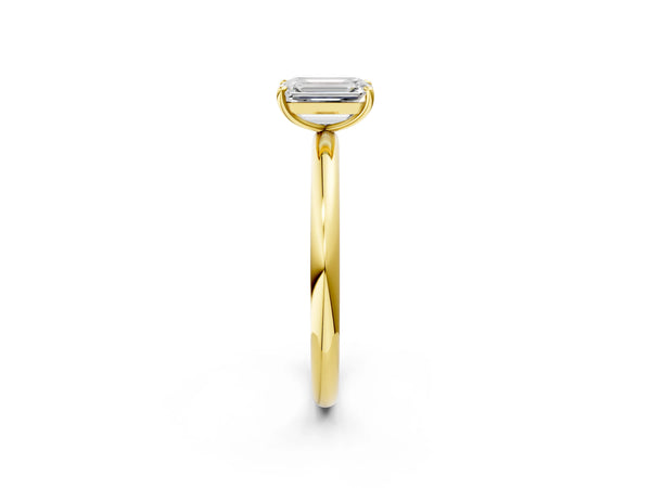 Yellow gold Emerald Solitaire Diamond Ring with Four-Prong Setting on a Plain Band