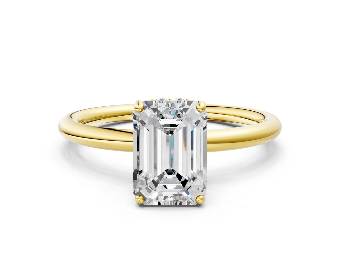 Yellow gold Emerald Solitaire Diamond Ring with a Classic Band and Four-Prong Setting