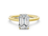 Yellow gold Emerald Solitaire Diamond Ring with a Classic Band and Four-Prong Setting