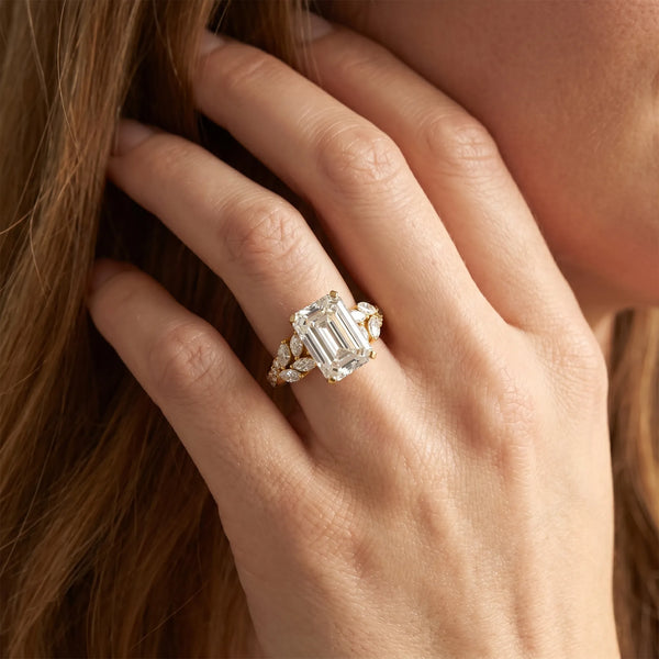 Yellow gold Emerald Solitaire Marquise Twist Band with Six-Prong Setting