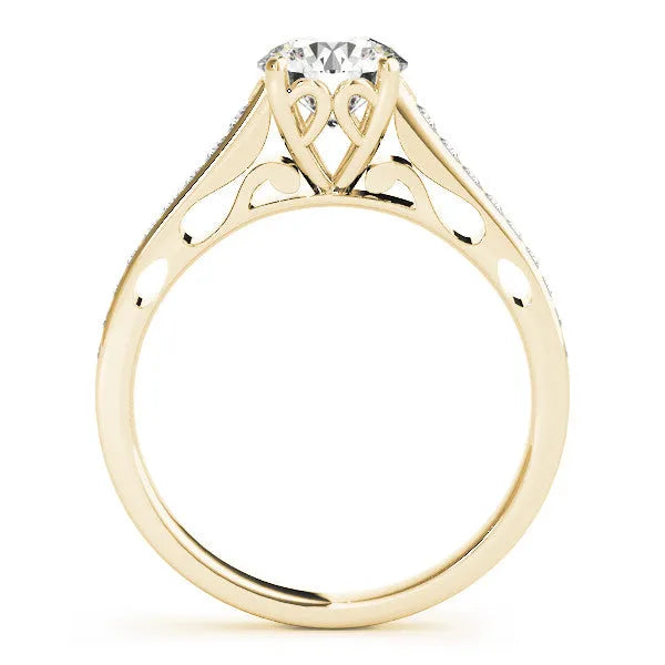 Yellow gold Emerald Solitaire Prong Set Diamond Engagement Ring with Pave Band