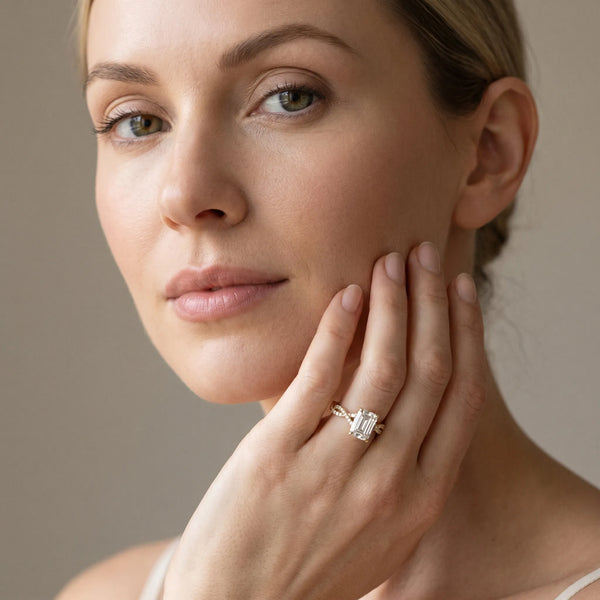 Yellow gold Emerald Solitaire Twisted Pave Band with Four-Prong Setting