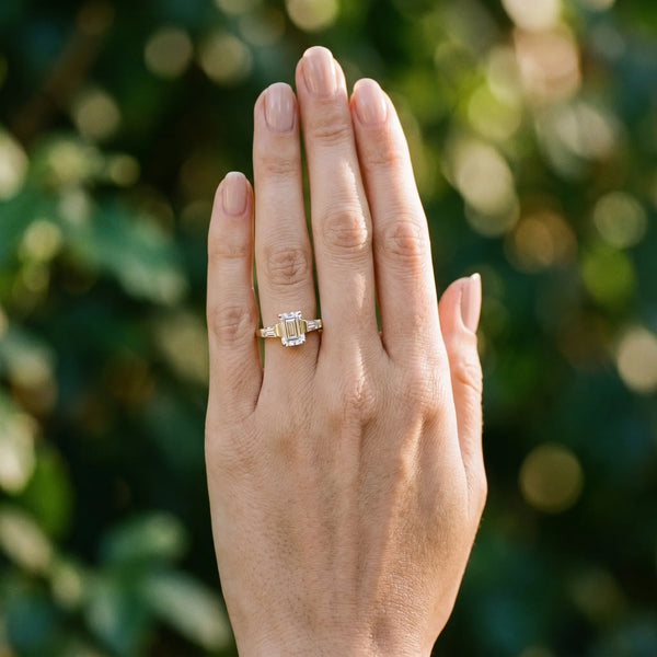 18K Yellow Gold 2.91 Carat D VVS2 Emerald Solitaire with Tapered Baguette Side Stones on a Classic Band with Four-Prong Setting
