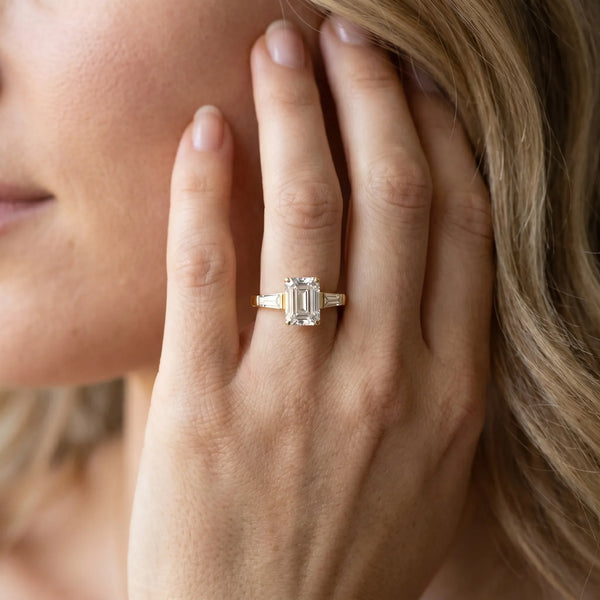 18K Yellow Gold 2.91 Carat D VVS2 Emerald Solitaire with Tapered Baguette Side Stones on a Classic Band with Four-Prong Setting