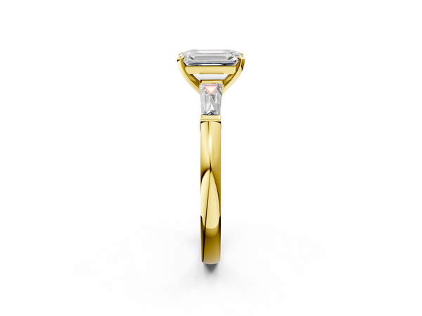 Yellow gold Emerald Solitaire with Tapered Baguette Side Stones on a Classic Band with Four-Prong Setting