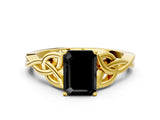 Yellow gold Fancy Black Emerald Cut Diamond Solitaire Engagement Ring with Celtic Knot Band and Four-Prong Setting