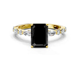 Yellow gold Fancy Black Emerald Cut Diamond Solitaire with Side Stones on a Pavé Band and Four-Prong Setting