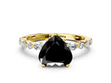 Yellow gold Fancy Black Heart Cut Diamond Solitaire with Side Stones on a Pavé Band and Four-Prong Setting