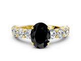 Yellow gold Fancy Black Oval Cut Diamond Prong Setting with Side Stones on a Pave Band