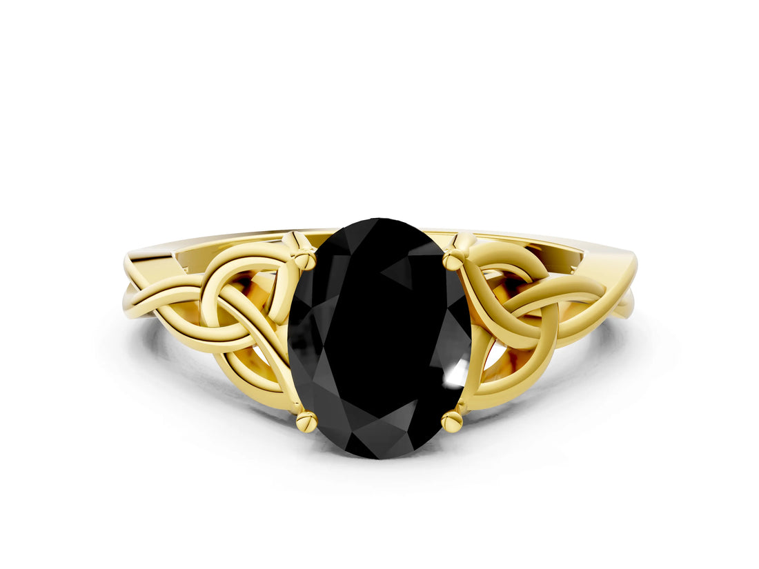Yellow gold Fancy Black Oval Cut Diamond Solitaire Engagement Ring with Celtic Knot Band and Four-Prong Setting