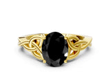 Yellow gold Fancy Black Oval Cut Diamond Solitaire Engagement Ring with Celtic Knot Band and Four-Prong Setting