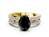 Yellow gold Fancy Black Oval Cut Diamond Solitaire Ring with Pavé and Channel Set Band