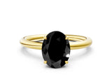 Yellow gold Fancy Black Oval Cut Diamond Solitaire Ring with Thin Band and Four-Prong Setting