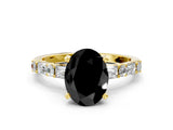 Yellow gold Fancy Black Oval Cut Diamond Solitaire with Side Baguettes and Channel Set Band