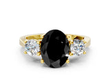 Yellow gold Fancy Black Oval Cut Diamond Three-Stone Engagement Ring with Prong Setting and Pavé Band