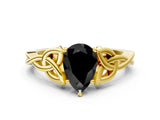 Yellow gold Fancy Black Pear Cut Diamond Solitaire Engagement Ring with Celtic Knot Band and Four-Prong Setting