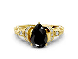 Yellow gold Fancy Black Pear Cut Diamond Solitaire Ring with Filigree Band and Four-Prong Setting