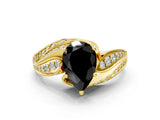Yellow gold Fancy Black Pear Cut Diamond Solitaire Ring with Prong Setting and Twisted Pavé Band