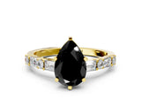 Yellow gold Fancy Black Pear Cut Diamond Solitaire with Side Baguettes and Channel Set Band