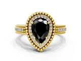 Yellow gold Fancy Black Pear Cut Halo Diamond Ring with Beaded Split Shank and Four-Prong Setting