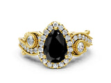 Yellow gold Fancy Black Pear Cut Halo Diamond Ring with Milgrain and Bezel Accents on a Split Shank Band_12