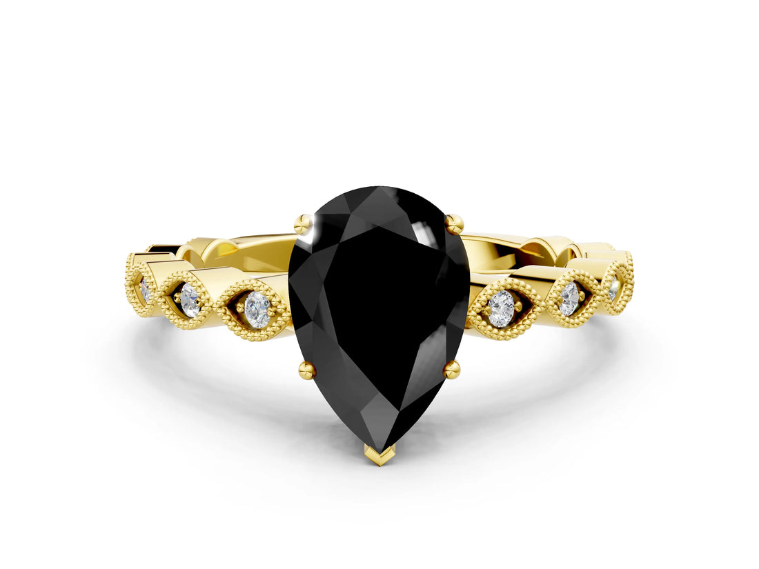 Yellow gold Fancy Black Pear Cut Solitaire Diamond Ring with Infinity Twist Band and Four-Prong Setting