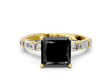 Yellow gold Fancy Black Princess Cut Diamond Solitaire with Side Baguettes and Channel Set Band