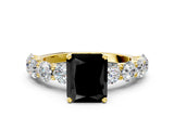 Yellow gold Fancy Black Radiant Cut Diamond Prong Setting with Side Stones on a Pave Band